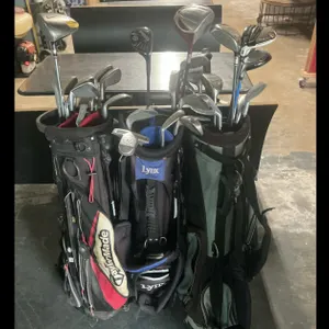 Golf Bags with Drivers and Assorted Clubs