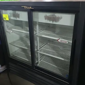 True GDM-41C-48 2-door glass door merchandiser. Features sliding glass doors, adjustable wire shelves, black exterior, and white interior. Self-contai