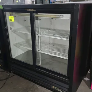 True GDM-41C-48 2-door glass door merchandiser. Features a black exterior, white interior, sliding glass doors, and adjustable wire shelves. Self-cont