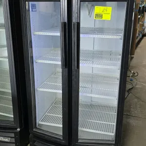 True GDM-14RF-LD glass door merchandiser. Features a black exterior with 2 swing glass doors, LED interior lighting, and an illuminated header. Includ