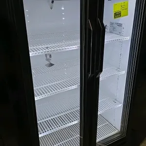 True GDM-30-LD 2-door glass door merchandiser cooler. Features a black exterior with white aluminum interior, LED lighting, and adjustable wire shelve