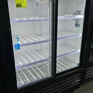 2025 True GDM-41SL-60-HC-LD 2-door glass door merchandiser cooler. Features LED lighting, sliding glass doors, black exterior, white aluminum interior
