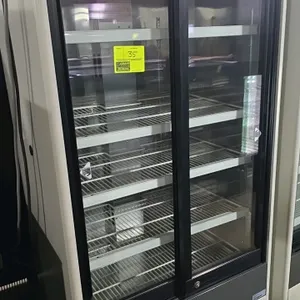 Panasonic MPR-514 vertical refrigerator. Features sliding glass doors, digital temperature display, adjustable wire shelves, and self-contained refrig