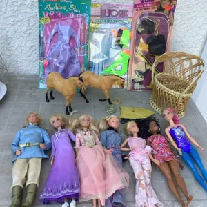 Dolls, doll clothes, wicker chair, horses, etc.
