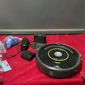 IROBOT ROOMBA VACUUM W/ EXTRA PARTS - LITTLE BROOMS, FILTERS, ETC.