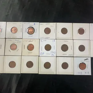 18 Canadian One Cent Coins 1953–1987 In Cardboard Holders