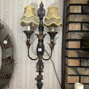 Black and gold electric light sconce (matches