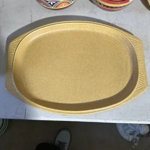 14 in yellow stoneware and 12.5 platter