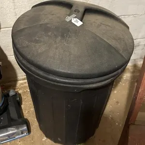 24 in t garbage bin full of Xmas garland w lights