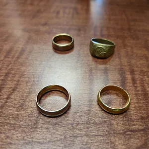 4 ASSORTED  GOLD RINGS