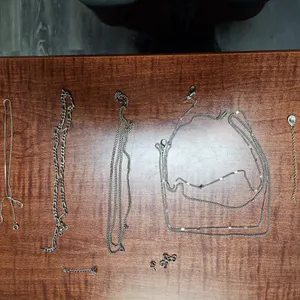 ASSORTED CHAINS & BRACELETS SILVER AND GOLD; SOME BROKEN,
