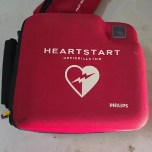 Philips HeartStart FR2+ automated external defibrillator (AED). Includes zippered carrying case, fast response kit pouch, battery pack, and child pads