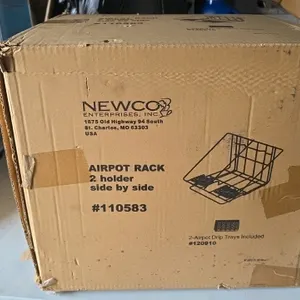 Newco 110583 2-holder side-by-side airpot rack. Features a wire frame construction with two included airpot drip trays (part #120910). New in box.