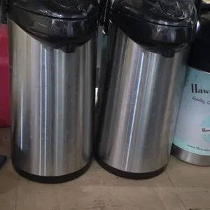 Service Ideas GLAP 3.0L airpot hot beverage dispenser. Features a stainless steel exterior, black plastic lever-action pump lid, and carry handle. Bui