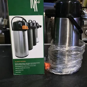 Koffee by the Kup KK 2.2-liter airpot coffee dispenser. Features brushed stainless steel exterior, glass vacuum liner, and a swivel base. Outfitted wi