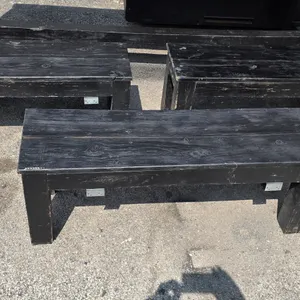 Wooden bench. Features solid wood construction with a black finish, 2-plank seat design, and metal reinforcement brackets on the underside. 48"W x 14"