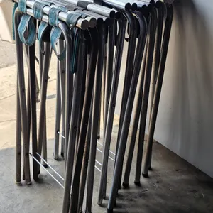 Metal folding tray stand. Features a tubular metal frame with fabric support straps. Designed to fold flat for compact storage and transport.