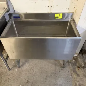 New England Air insulated ice bin. Features stainless steel construction, integrated backsplash, and a removable perforated bottom drain plate. Mounte