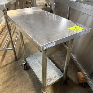 New England stainless steel equipment stand. Features a stainless steel top with a rear backsplash and a galvanized steel undershelf. 18"W x 30"D x 33