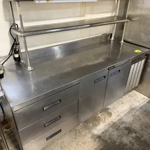 Delfield flat top worktable refrigerator. Features stainless steel construction, 3 drawers, 2 doors, and a double overshelf. Dimensions: 84"W x 31"D x
