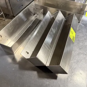 Stainless steel liquor bottle speed rail lot. Includes (1) 22"L two-tier speed rail and (2) 22"L single-tier speed rails. Features stainless steel con