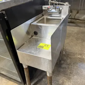 Regency 600BSDS2312 stainless steel blender station with integrated dump sink. Features a splash-mounted faucet, sink bowl, blender shelf with a cord 