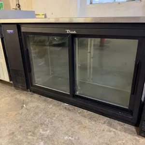 True TBB-24-60G-SD-HC-LD sliding glass door back bar bottle cooler. Features black vinyl exterior, stainless steel countertop, and LED interior lighti