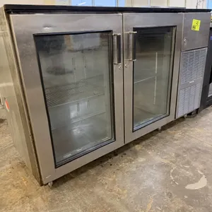 Perlick C5063ESCUL two-door glass door back bar refrigerator. Features stainless steel construction, two hinged glass doors, adjustable wire shelving,