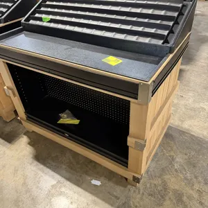 JSI Store Fixtures wooden produce and bakery display table. Features a sloped top display area with a black plastic pan and a ribbed tray insert, a wo