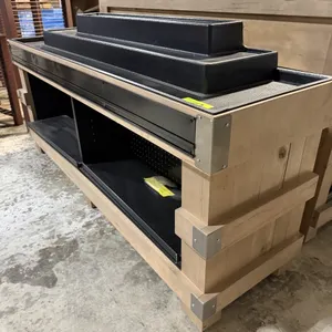 JSI Store Fixtures wooden end cap display table. Features a wooden exterior with metal corner brackets, a black interior with two shelves, and a black