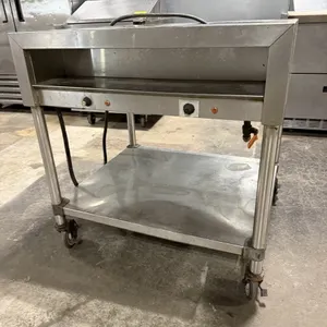 Unknown two-well electric steam table. Features stainless steel construction with two individually controlled wells, a lower undershelf, and an integr