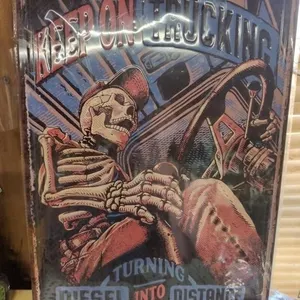 Skeleton trucking metal sign still in plastic