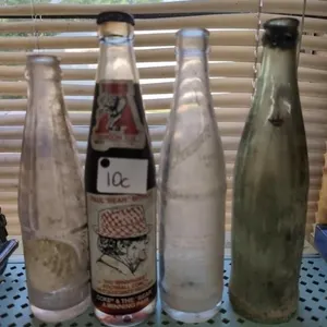 Coke Bear Bryant bottle, RC Cola bottle, other