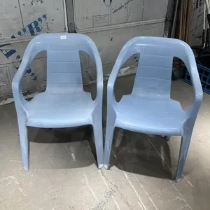 2 blue plastic yard chairs