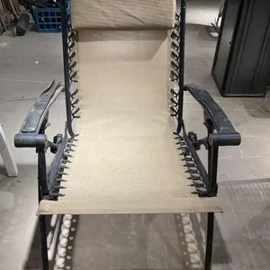 Lawn chair with leather armrest.