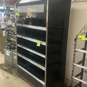 Barker IPC13F 4'L multi-tier open display case. Features four tiers of solid black shelving, interior lighting, and black exterior with stainless stee