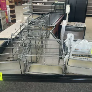 Stainless steel wire grocery bagging stand. Features a wire frame construction designed to hold plastic t-shirt style grocery bags and includes a plas