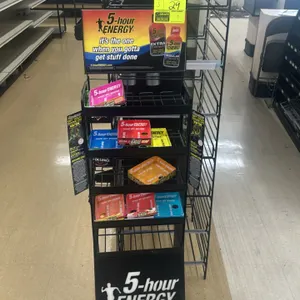 Assorted metal multi-tier merchandisers. Package includes (1) 5-Hour Energy branded mobile wire display rack with header card and casters, (1) black m