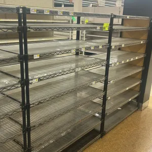 Metro multi-tier wire shelving rack. Features black epoxy-coated steel construction with eight adjustable wire shelves and clear plastic shelf liners.