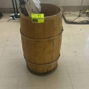 Wooden display barrel bin. Features wooden stave construction with metal banding hoops and an open-top design. Includes contents as shown, including p