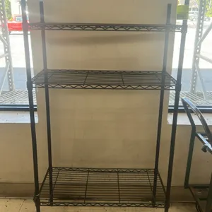 Metal wire shelving rack. Features 3 adjustable wire shelves on 4 posts. 36"W x 18"D x 65"H. Black finish. Cart in background not included.