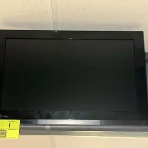 Toshiba 25" HD television. Features a black bezel and flat-panel display. Wall-mounted. Remote control is not included.
