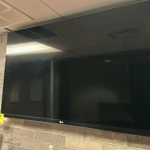 LG 55" HD flat-panel television. Features a slim bezel design and black finish. Note: Wall mount bracket and remote control are not included.