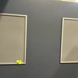 Set of (2) quick-snap movie poster frames. Features silver-finished aluminum flip-open borders for front-loading graphic updates. Designed for wall mo