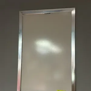 Movie theater poster frame. Features a silver-tone metal frame designed for displaying poster media. Wall-mounted. 28"W x 40"H. Poster not included.