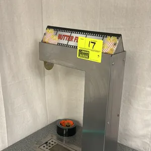 2012 Gold Medal 2396A Counter Butter Dispenser. Features a stainless steel countertop dispensing tower with a lighted 'Butter Flavoring' sign, an inte