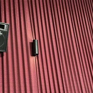 Peavey professional movie theater audio speakers. Features a wall-mount cabinet design with integrated horn tweeters and woofers. Finished in textured