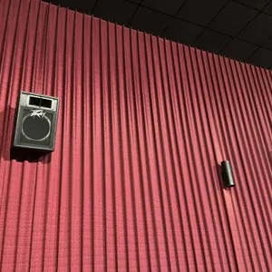 Peavey professional movie theater audio speaker. Features a black textured cabinet with an integrated horn tweeter and single woofer behind a protecti