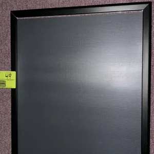 A Movie Theater Poster Frame. Designed for displaying theatrical prints and promotional posters, this frame features a black metal snap-open border fo