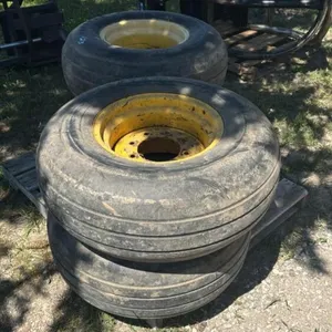 (4) 12.5L-16SL GOODYEAR TIRES ON 8 BOLT RIMS